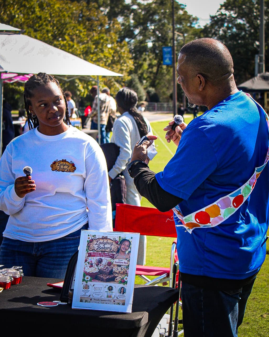 Greg Covert speaking with the young founder of Ladybug Bakery